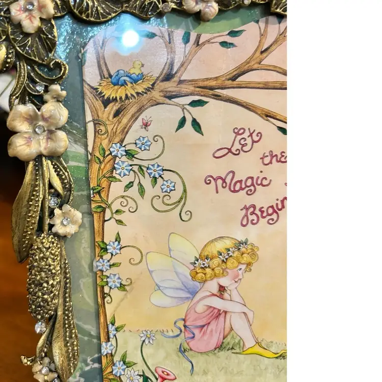 Mary Engelbreit Fairy Card named "Let the Magic Happen"  Framed in Peach Metal Enamel.