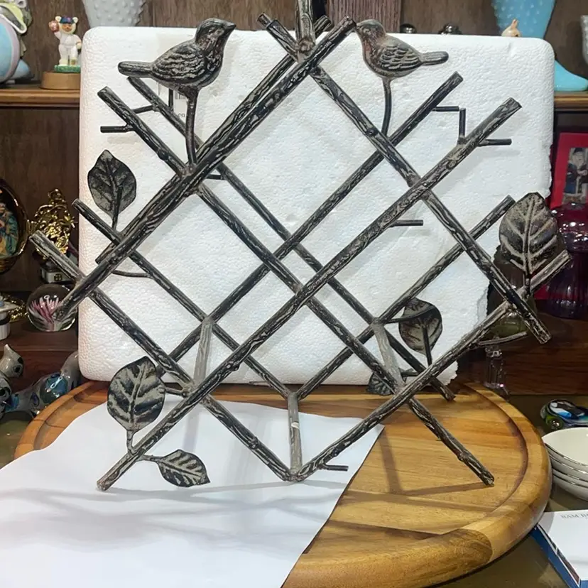 Wine Holder Rack Metal Birds And Leaves holds four bottles of wine