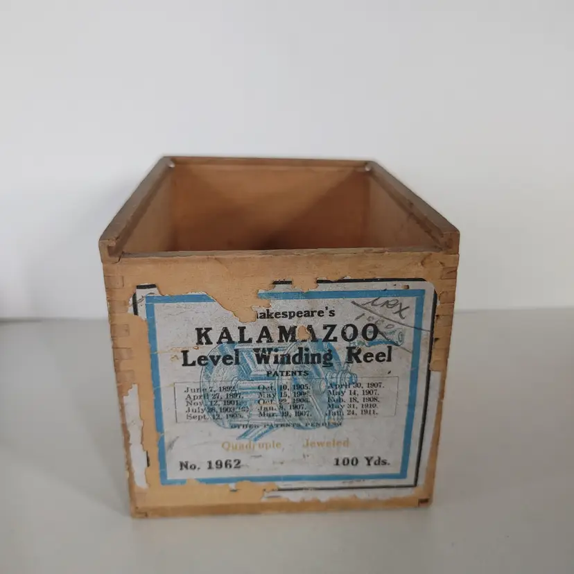 Antique wood tackle box for a fishing reel. Shakespeare's Kalamazoo. No lid. 3.5w x 3.5h x 4.75d.