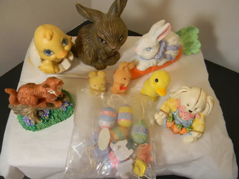 Easter Decorations with bunnies, flocked duck and bunnies, fox, candle, and box of eggs and Misc.