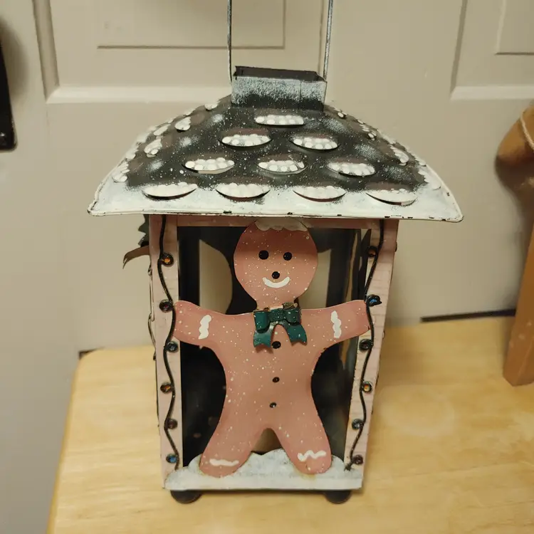 Christmas Lantern. Alternating tree and gingerbread man. Made of metal. 10 inches high.