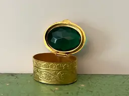 Antique Pill / Snuff Box. Gold Tone Filagree Trinket Jewelry Box with Green Glass Cabochon