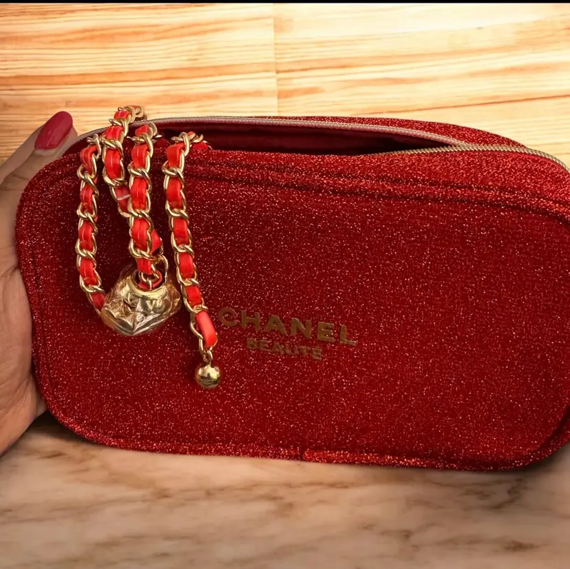 VIP Chanel Beauté pouch with gold-tone chain intertwined with red leather