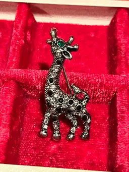 vintage silver-tone metal giraffe brooch with clear rhinestones, Black Enamel Spots and a green rhinestone eye