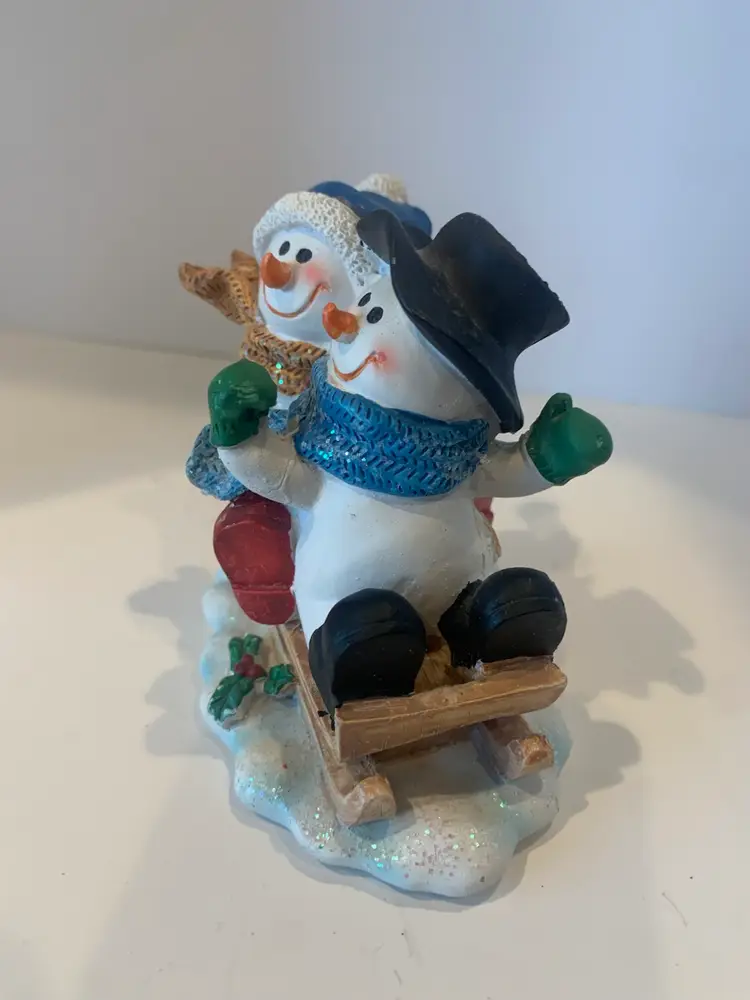 Snowman Couple Figurine Sledding