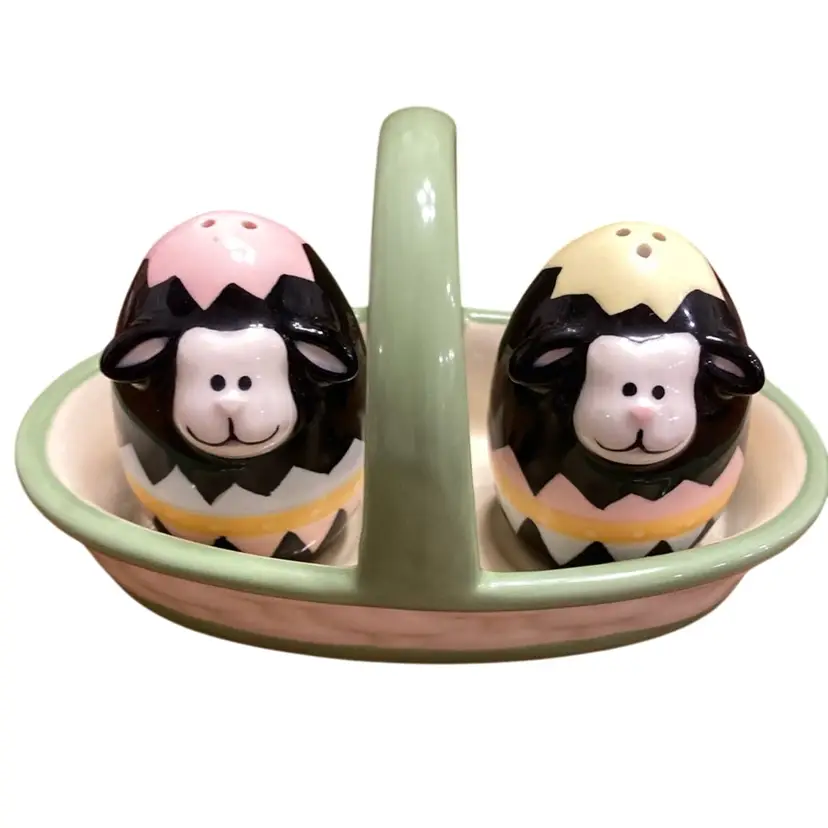 Two Small Cow Shakers In A Ceramic Basket With A Handle