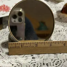 Vintage Round Mother Of Pearl Designed celluloid compact mirror with decorative metal trim. Circa 1940