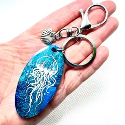 Handmade Blue Jellyfish 🪼 Resin Keychain With Shell Charm. Total keychain length 5-5/16”.