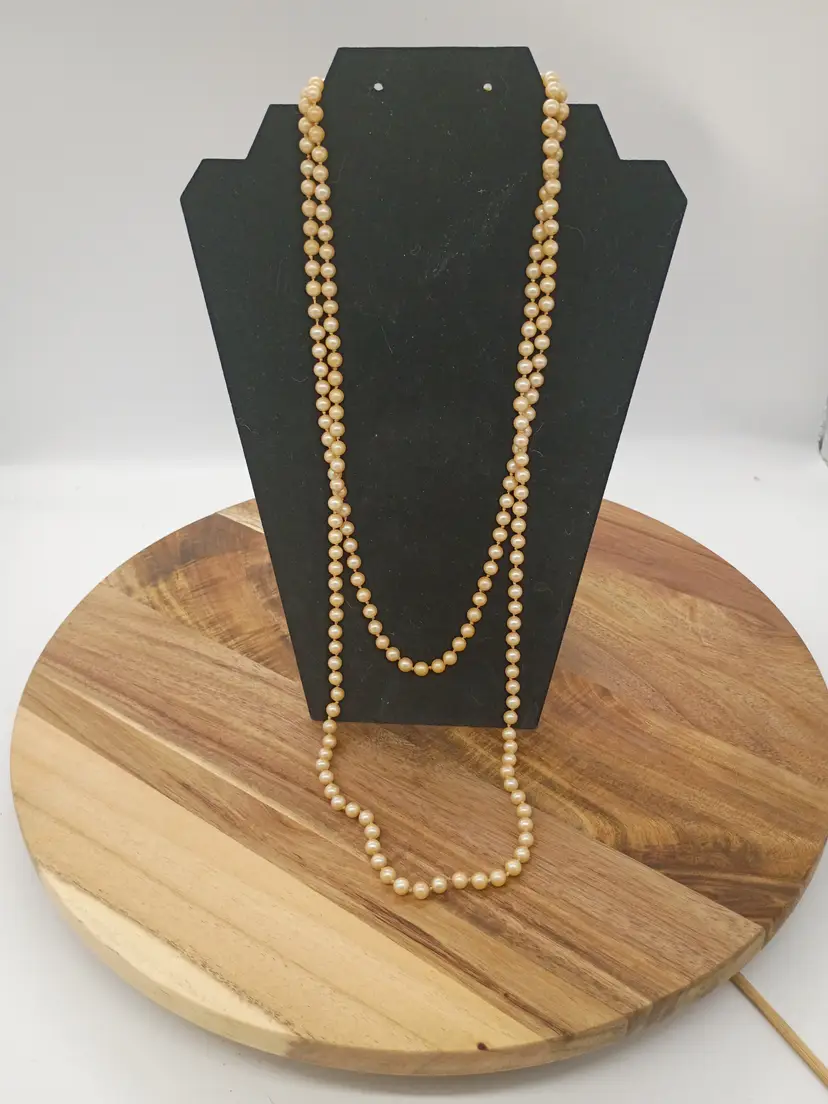 Vintage 56" Opera Length Knotted Lustrous 8 MM Faux Pearl Single Strand Necklace Silver tone clasp.