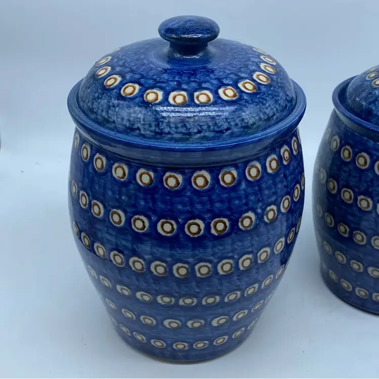 #2254 Pair of blue and yellow hand-painted Polish pottery canisters with lids.