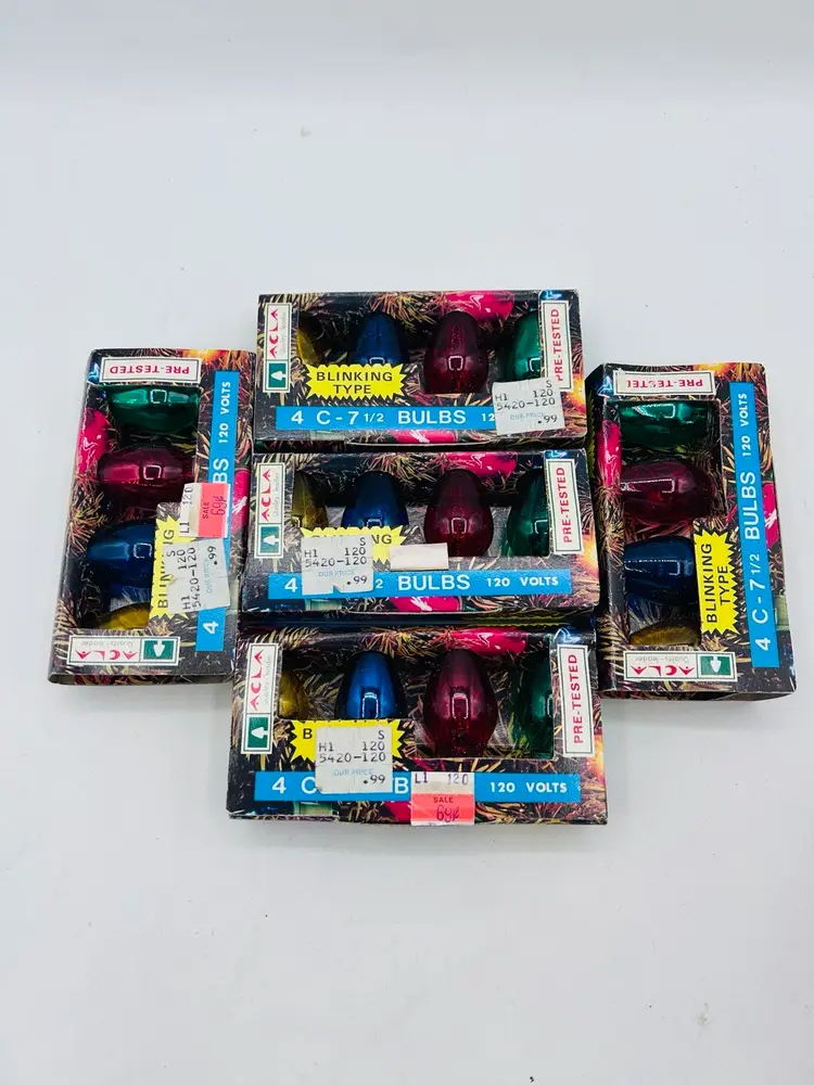 Vintage C7 1/2 blinking Christmas light bulbs. The box contains four bulbs of different colors