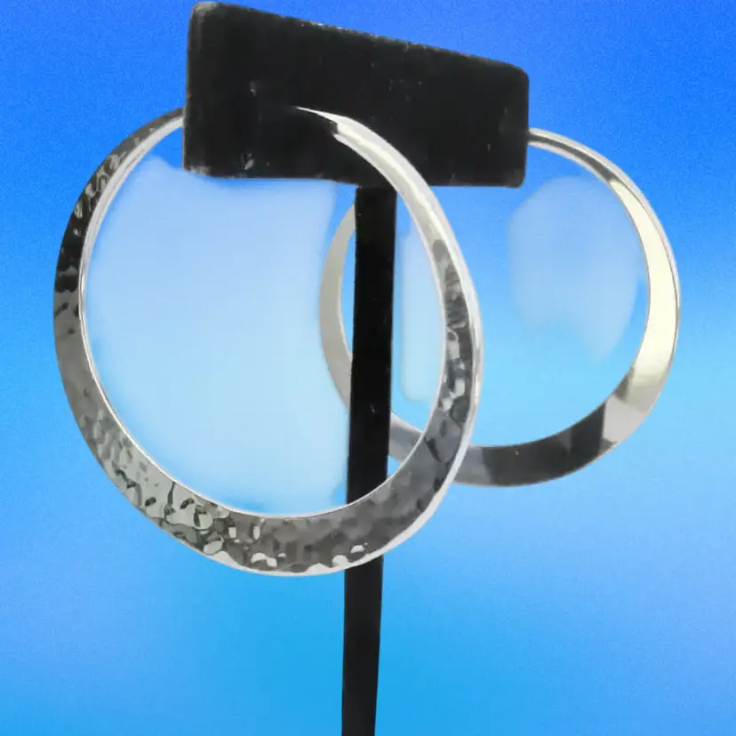 Designer sterling silver smooth hoop earrings with post and clasp closure.