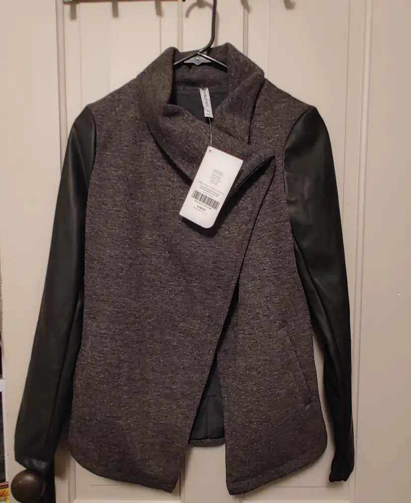 Jacket- Brand: Fabletics. Size XS. Grey Milano jacket. NWT. Retail $110. Material: 75% polyester, 25% viscose. No callouts.