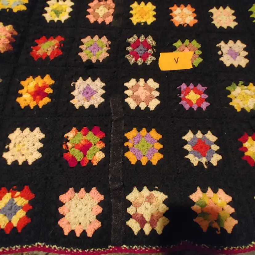 Afghan V- approx size 48 x 63. Granny square. Has velcro pieces on it. See pics. As shown.