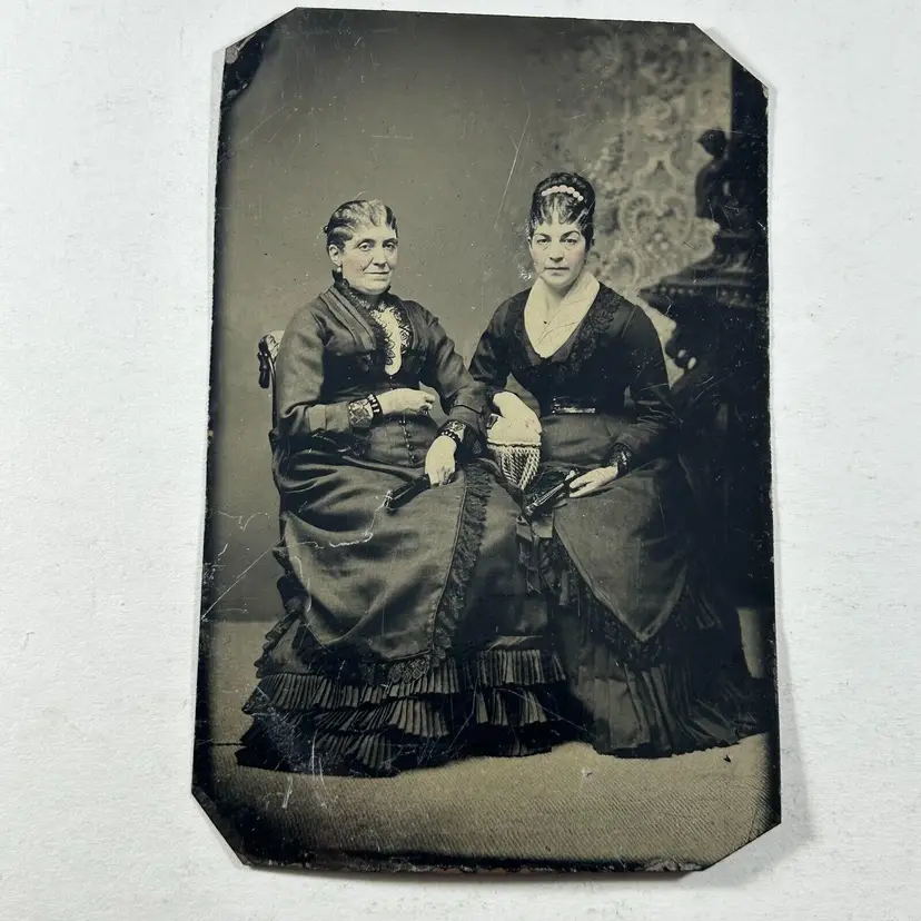 Tintype Pair of Women Seated Frilled Dress Tinted Cheeks Holding Paper Fans