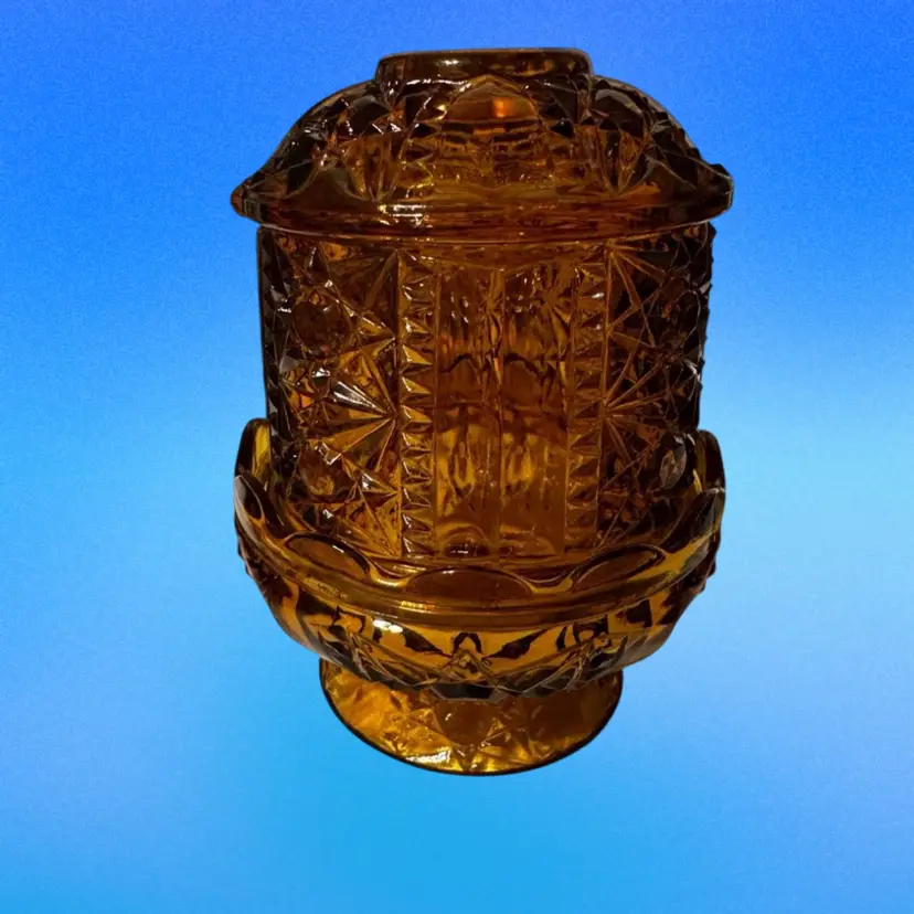 Vintage amber glass fairy lamp in the "Stars and Bars" pattern, produced by the Indiana Glass Company