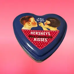 A vintage Hershey's Kisses "A Kiss For You" heart-shaped collectible tin