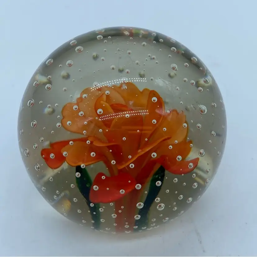 #0053 Vintage glass paperweight with an orange flower and controlled bubbles.
