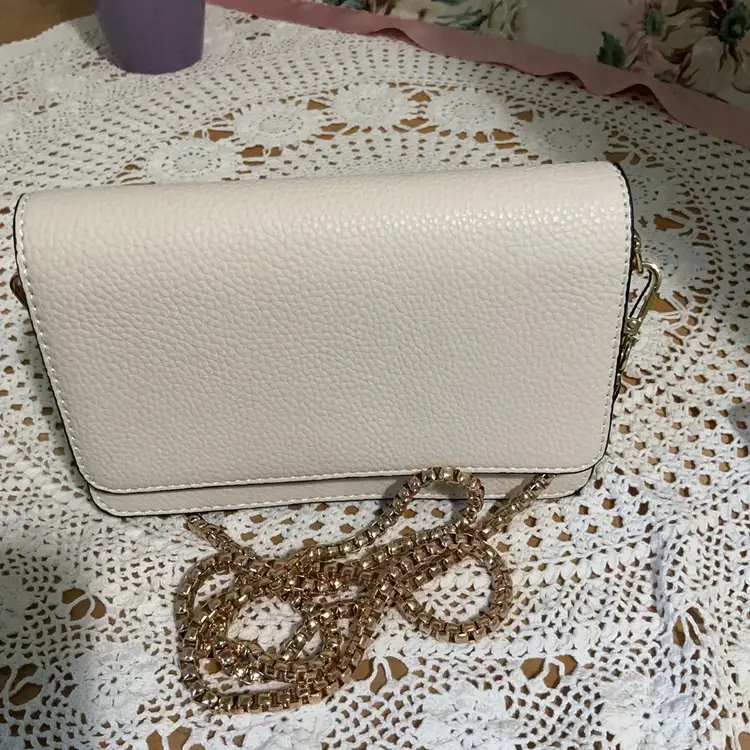 Beautiful New Cream / Neutral Colored Pebble Style Textured Crossover / Clutch  / Small Bag. Goldtone Detachable Chain / Strap . Black Satin Like Lining With Two Dividers And Small  Little Side Zip Up Pocket. Maker Mark Inside Reads Bagamour. Magnetic Snap Closure.