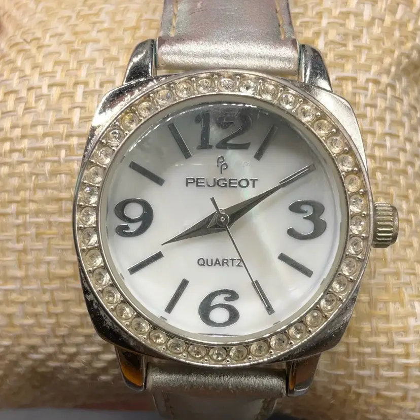 Peugot 3011 Silver Tone Silver Leather Band Clear Rhinestone Watch