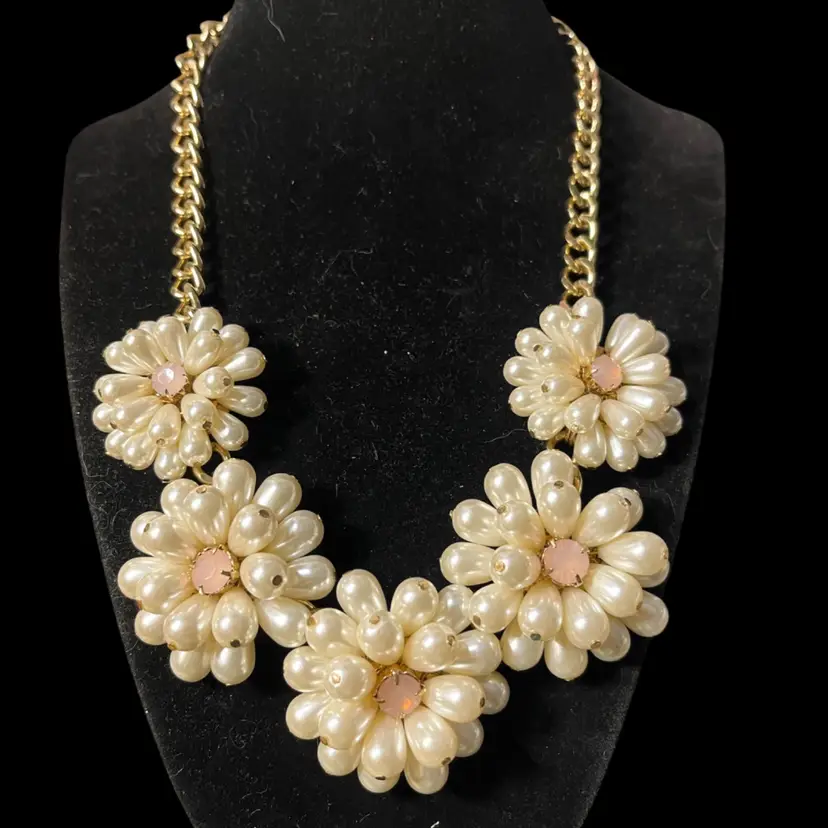 Five-flower cluster "bib" arrangement with teardrop-shaped faux pearls forming the petals.