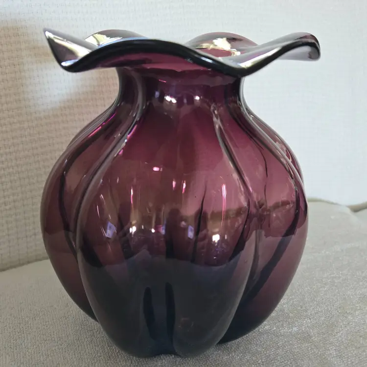 Amethyst Glass Vase With A Ruffled Rim And A Melon Shaped Base
