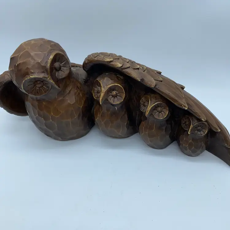 #1442 Heavy resin sculpture of a mother owl sheltering three owlets.