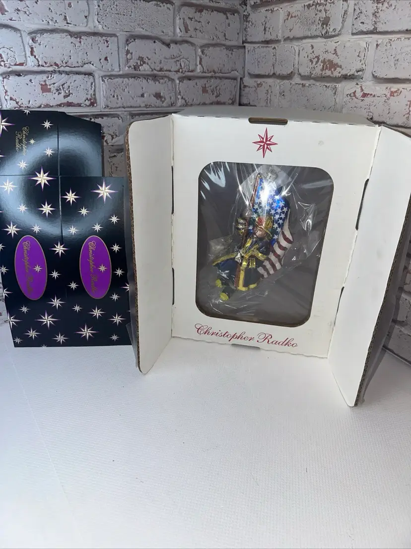 New In Box Christopher Radko Ornament American Bravest Firefighter Glass Christmas 8” Tall