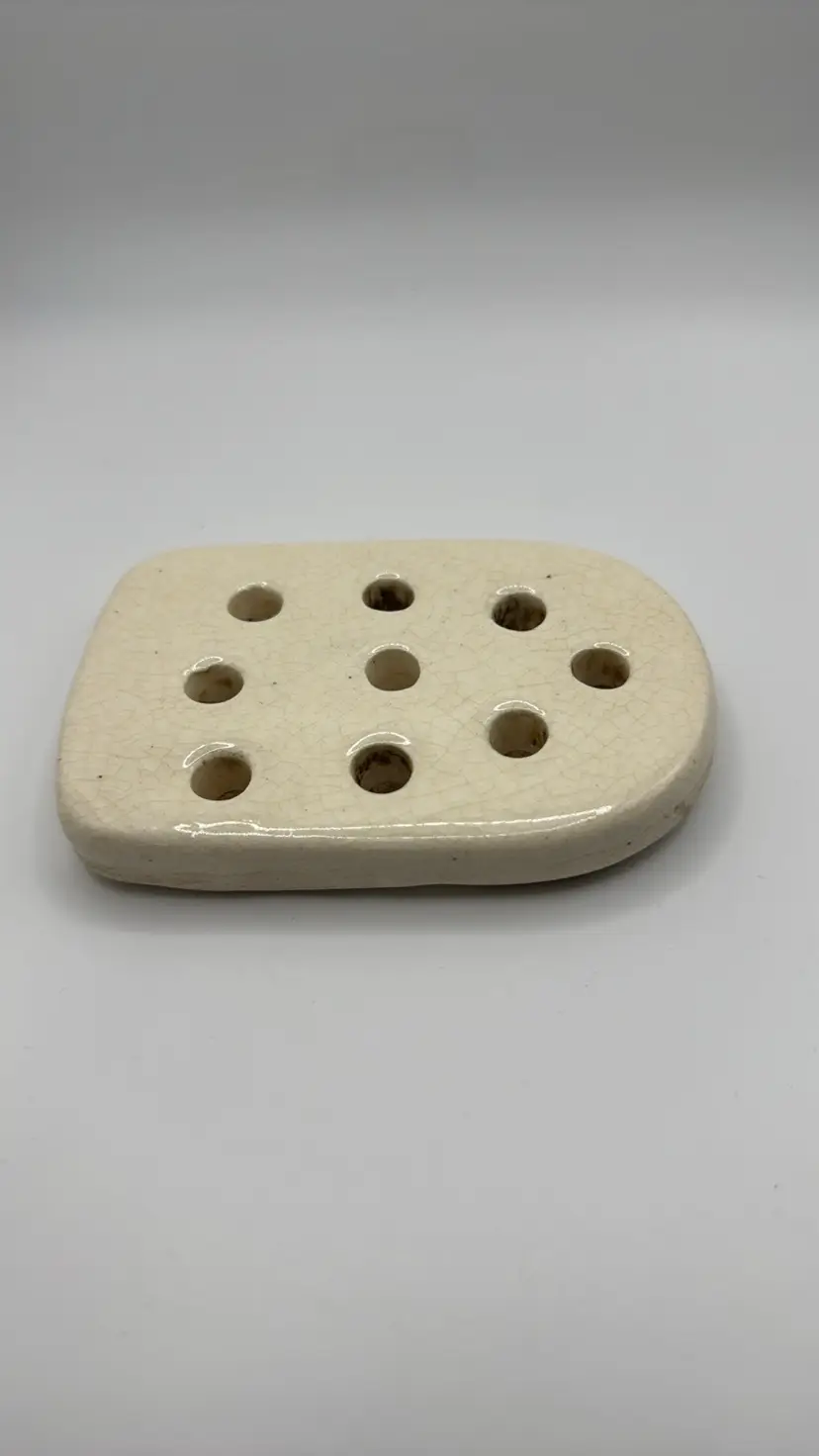 Cream pottery flower frog