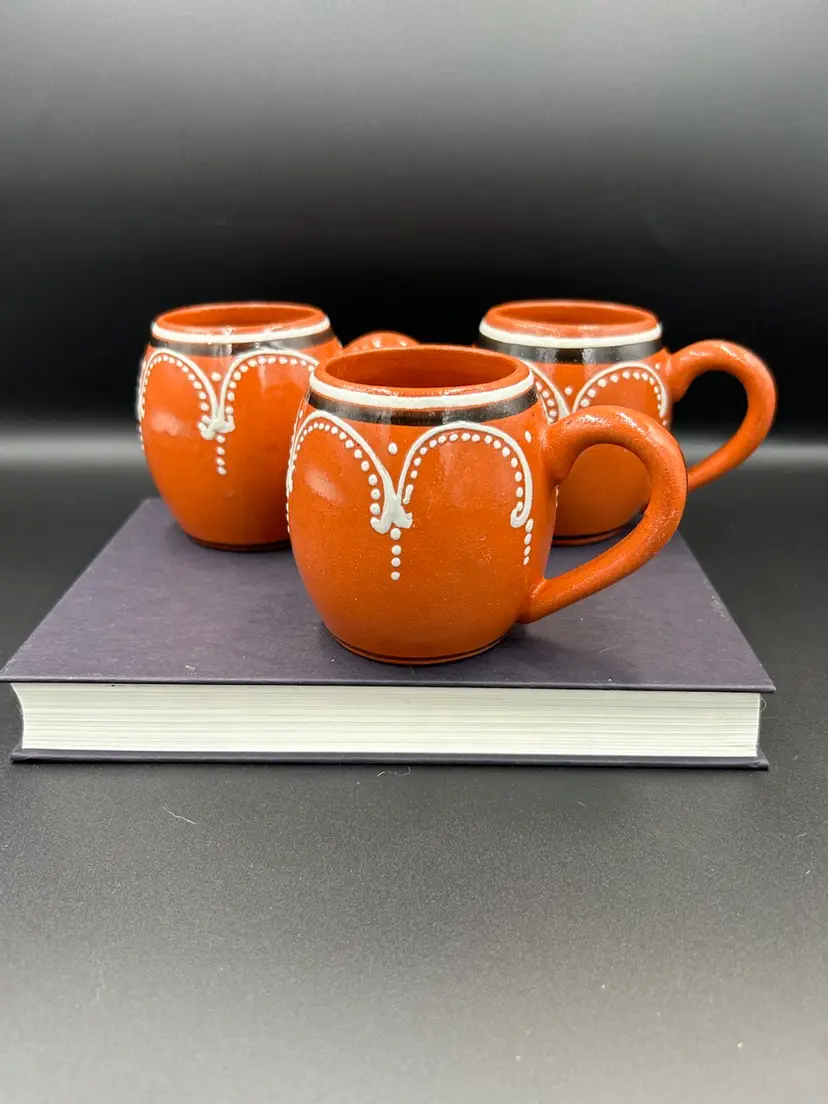 Set Of 2 in excellent condition and one has a crack (included For Free). Portugal Imports Red Ware Pottery Mugs. Made In Portugal