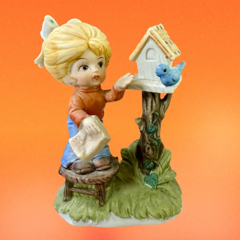 Girl Feeding Bird - Bisque Figurine