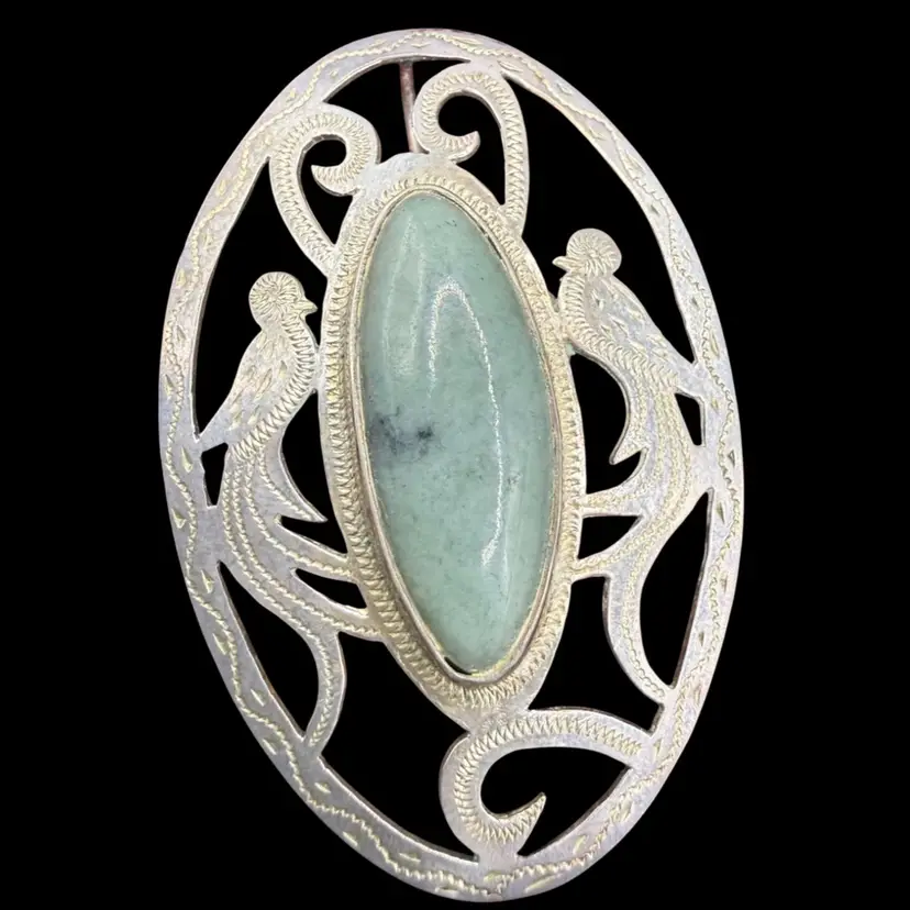 Vintage handcrafted sterling silver and green jade Brooch Pendent featuring a scrollwork design with bird motifs