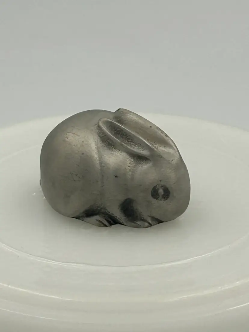 Small pewter rabbit figurine marked on bottom