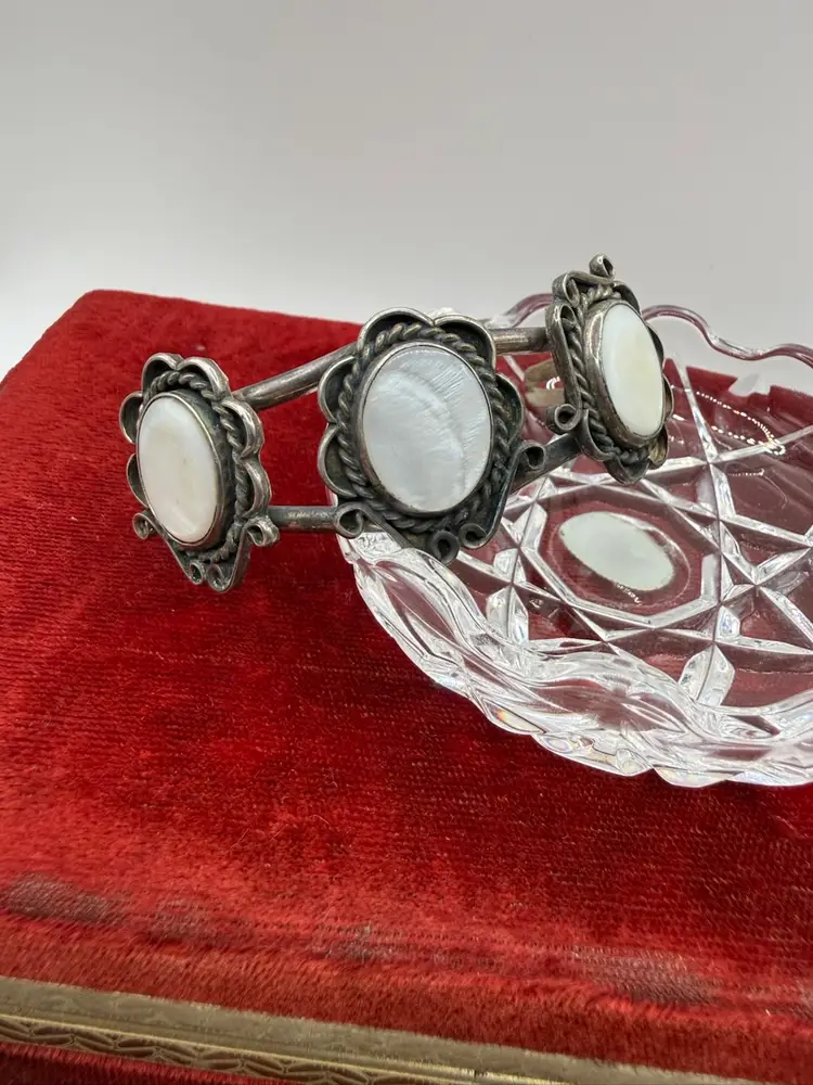 vintage Navajo-style sterling silver cuff bracelet featuring three oval mother-of-pearl cabochons