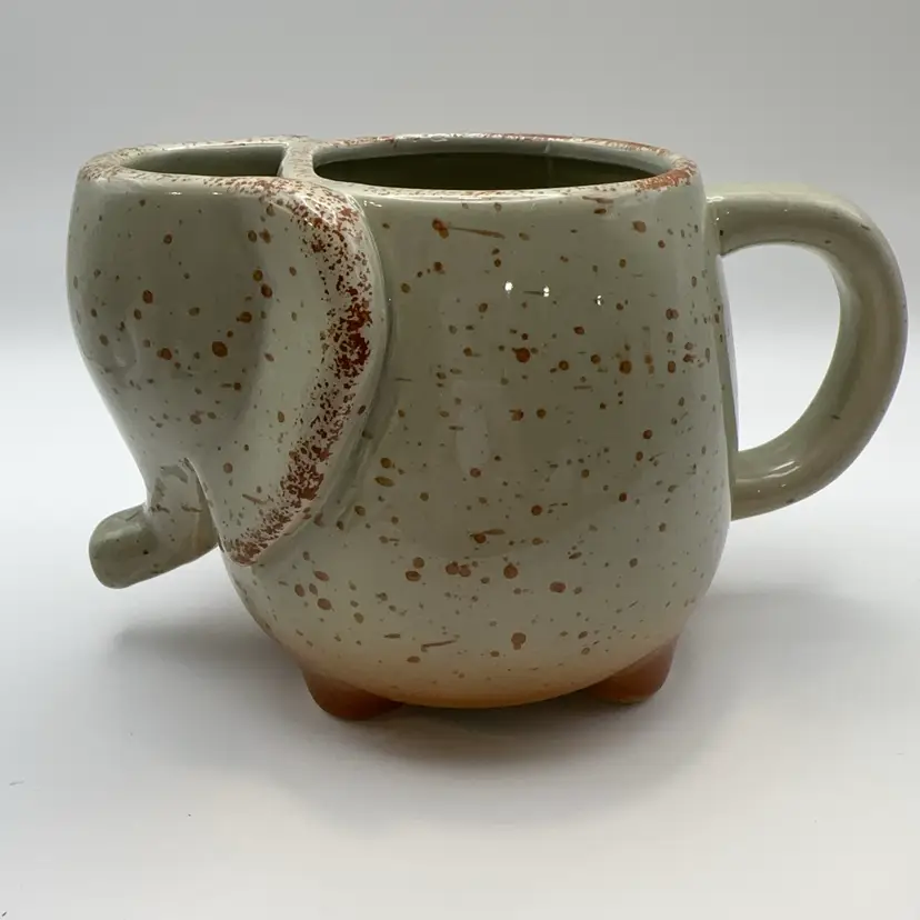 Stoneware elephant tea mug with a built-in tea bag holder
