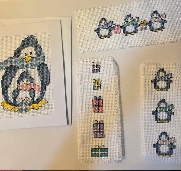 Lot of 11 Cross-stitched pieces Penguin Christmas themed New