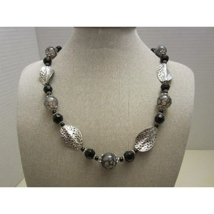 Black and marbled glass beaded necklace with silver twisted leaf necklace