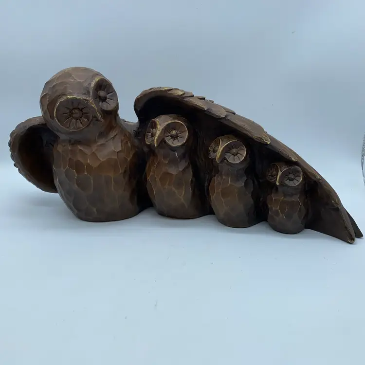 #1442 Heavy resin sculpture of a mother owl sheltering three owlets.