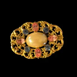 1928 Gold Tone Oval Brooch With Faux Pearl Center  And Pink And Blue Rhinestones