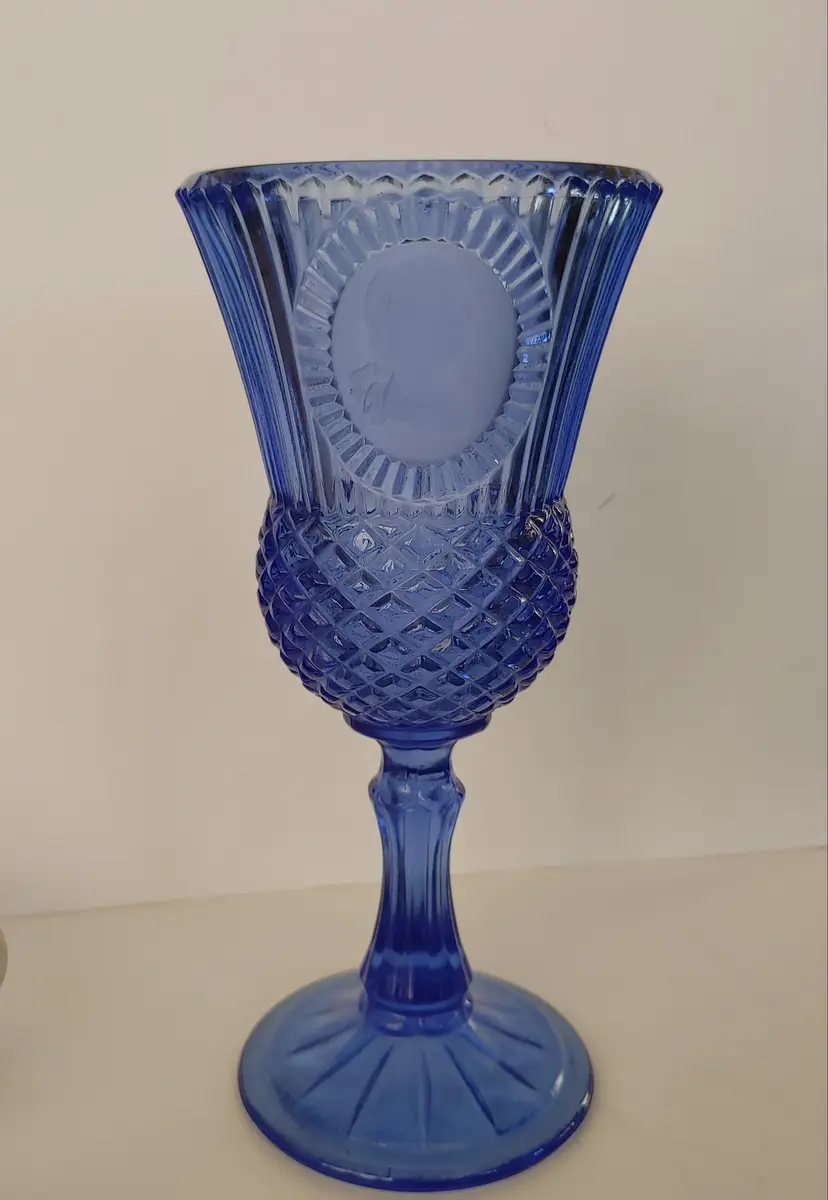 Cobalt blue goblet. Avon produced by Fostoria. Features George Washington cameo. 8 inches high. No chips or cracks.
