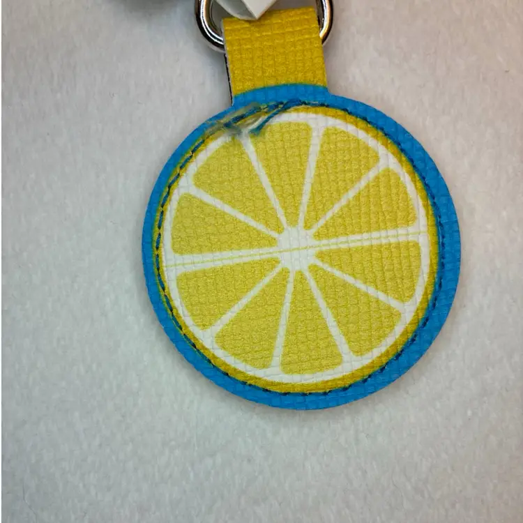 ALDI Quarter Holder Keeper Lemon Error Off Center NEW 2020 Keychain NWT