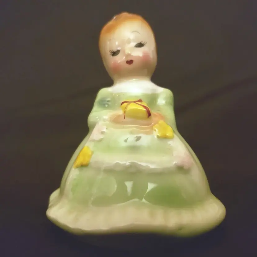Girl in Green Holding Present - Porcelain Figurine 3" tall - logo PY & NC JAPAN 