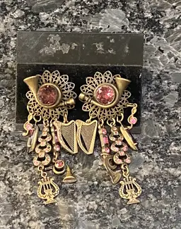 Pierced Earrings. Featuring Musical Instruments Motifs And Rhinestone Accents