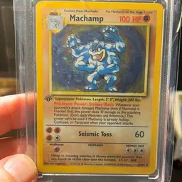 1999 Pokémon Base Set 1st Edition Machamp Holo Rare card (#8/102).
