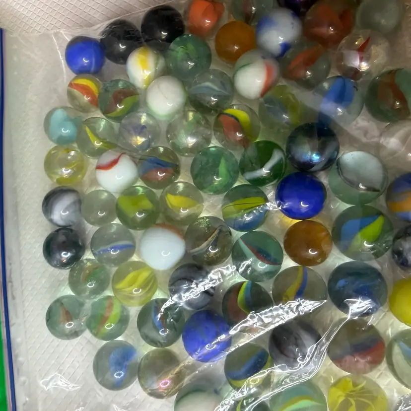 bag full of marbles vintage and moderns all mix in. all come as is
