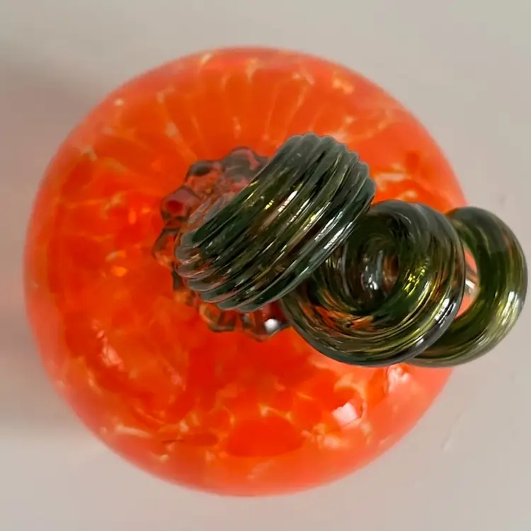 Handblown Glass Pumpkin – 4” Tall, 3”
Wide- Mottled Orange with Twisted Green Stem- UV Reactive