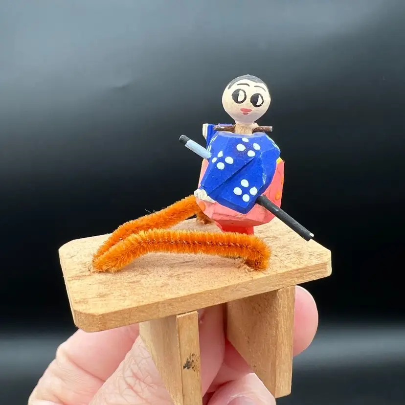 023. Tiny Kokeshi On A Sandal