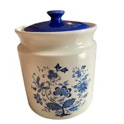 vintage ceramic kitchen canister featuring a blue and white floral pattern, commonly known as a blue onion style