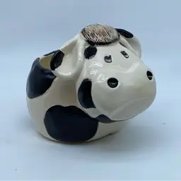 #4913 Signed ceramic cow novelty item by artist H. Gorrie, dated 1993.