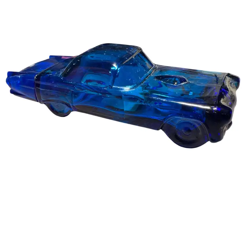 This is a vintage Avon cobalt blue glass 1955 Ford Thunderbird aftershave decanter.(empty)